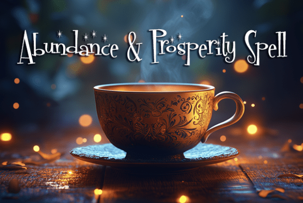 Cup of tea with text Abundance & Prosperity Spell