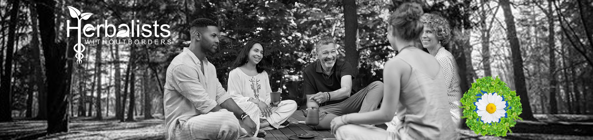 Group of people sitting in a circle outside, sharing a cup of tea.